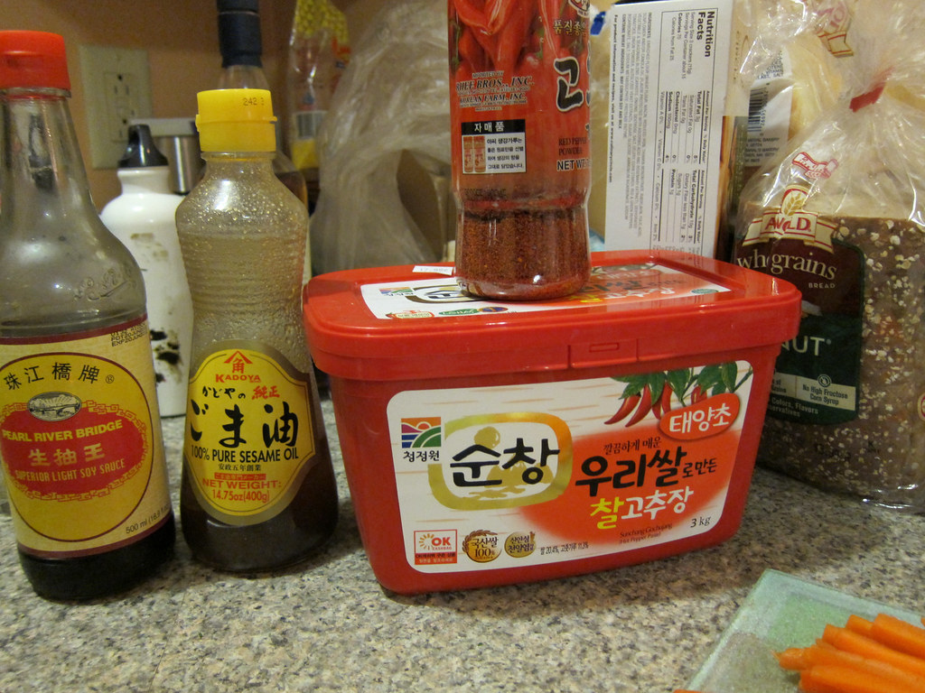 gochujang (fermented red chili paste), kochukaru (chili powder), soy sauce, sesame oil